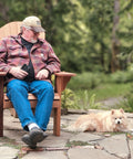 Man sitting in Handmade Cedar Adirondack Chair with Dog