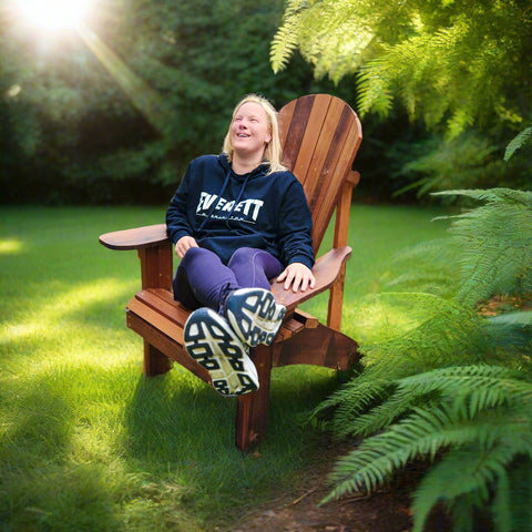 Woman Sitting in Upright Handmade Cedar Adirondack Chair